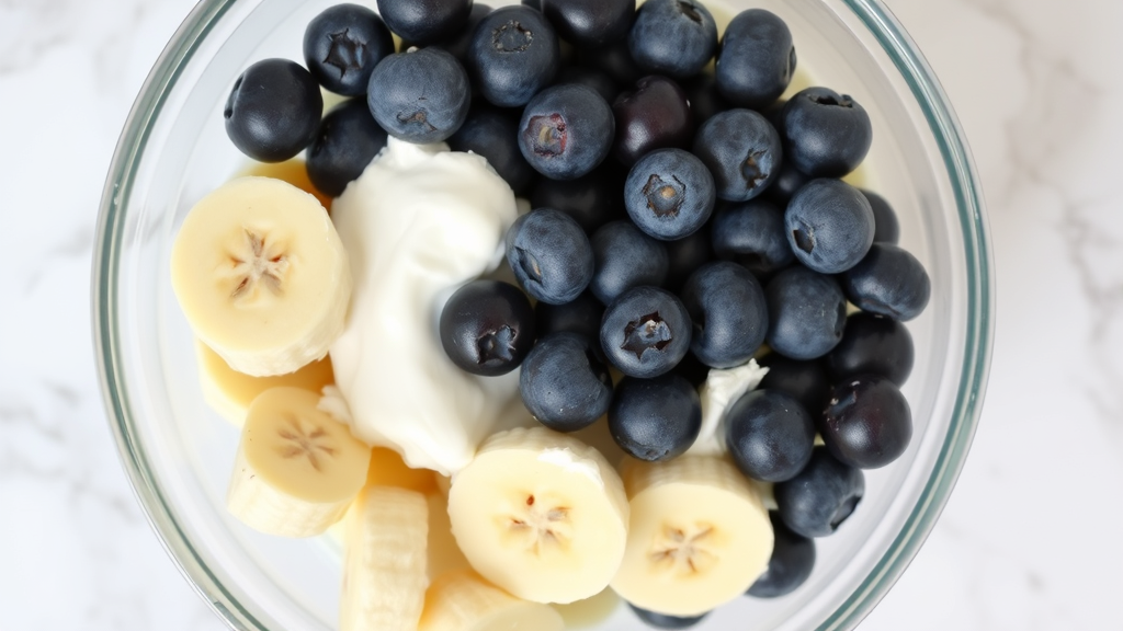 Various dog-safe fruits like blueberries and banana slices mixed with Greek yogurt in glass bowl, marble surface, no text no words no letters